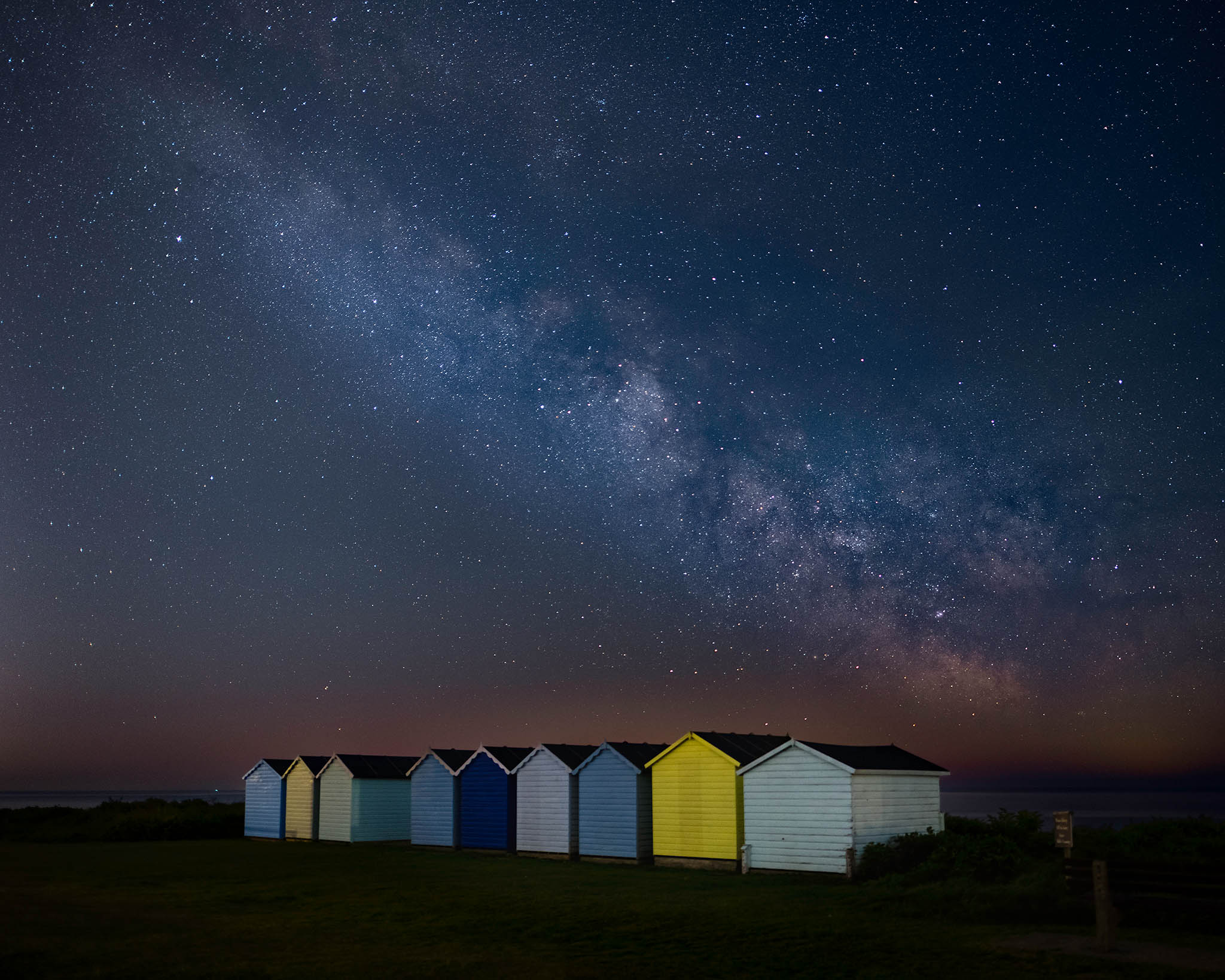 Beach Huts at night, South Downs National Park, England.
